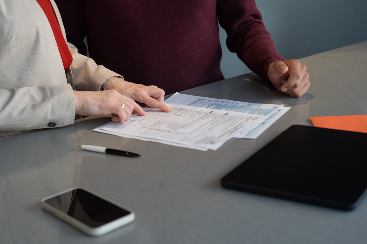 Two people reviewing a document together at a table